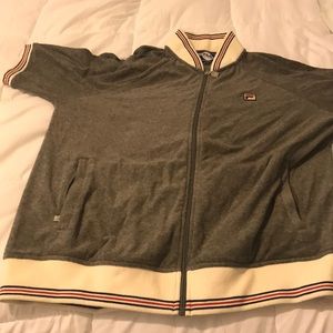 This is a Medium Fila short sleeve Zip up.